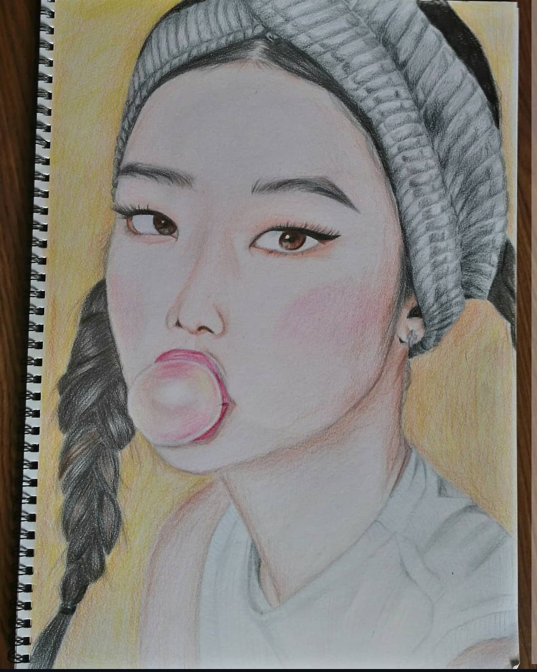 Bubble gum girl portrait in colour pencils on white paper