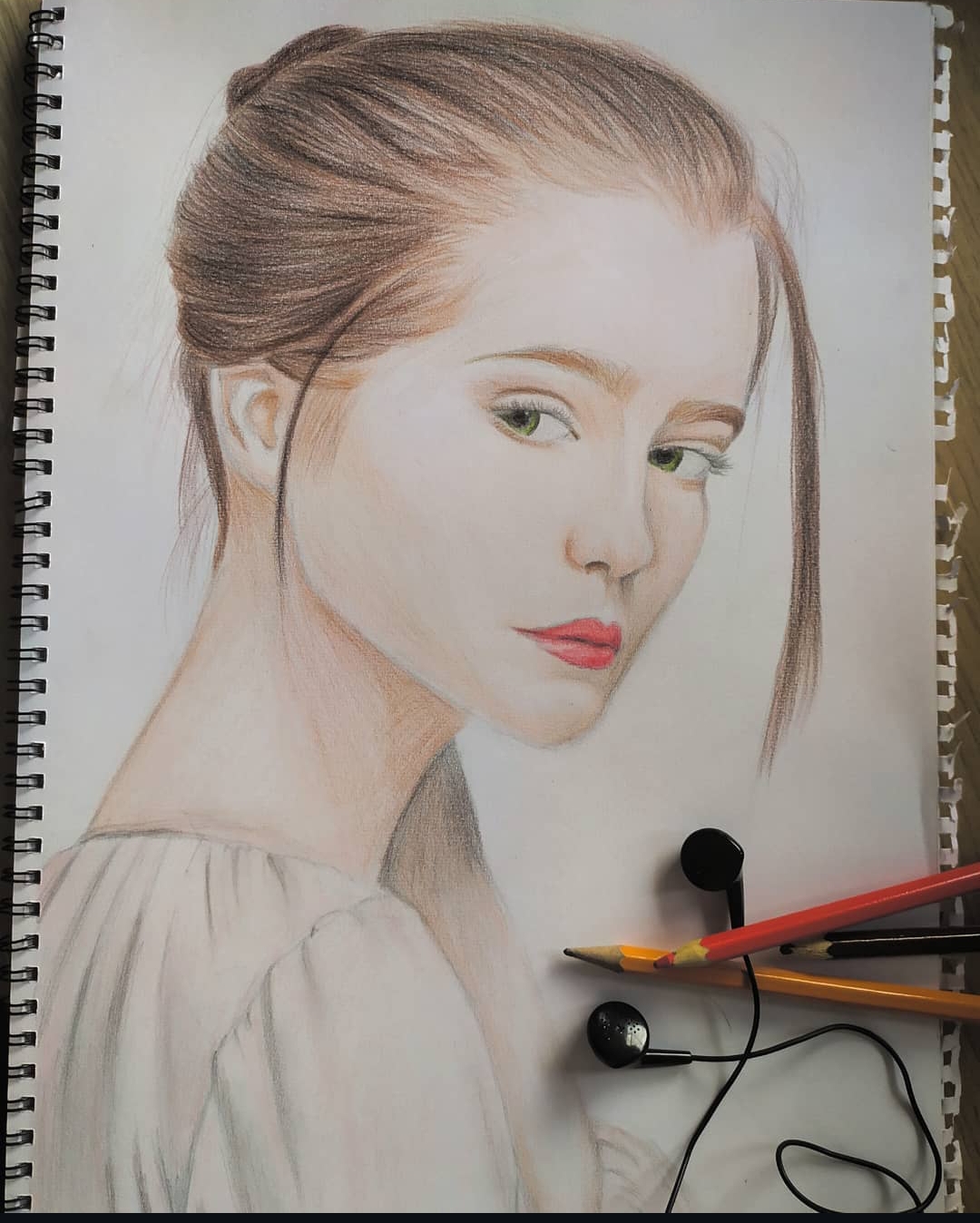 Portrait in colour pencils on white paper