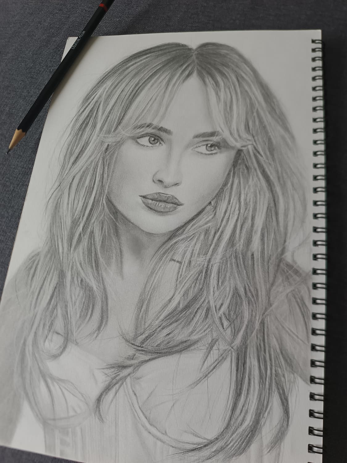 Portrait of Sabrina Carpenter, graphite on white paper