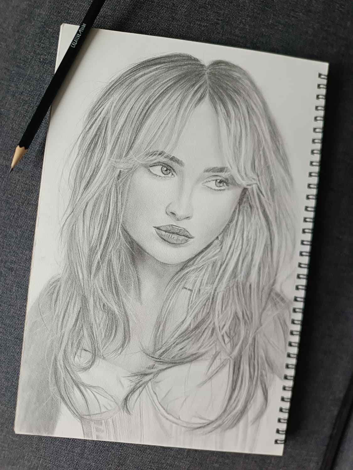 Portrait of Sabrina Carpenter, graphite on white paper